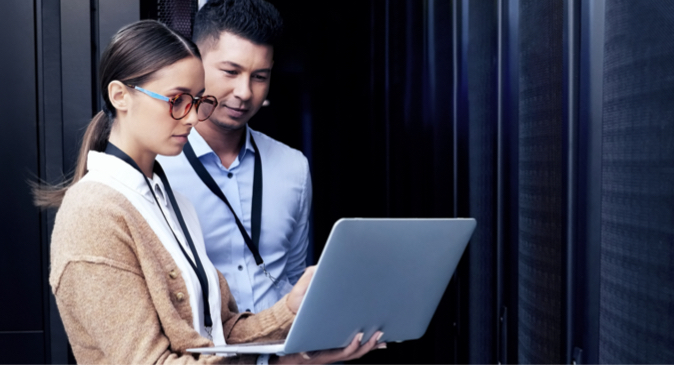 Man and a woman looking at a laptop