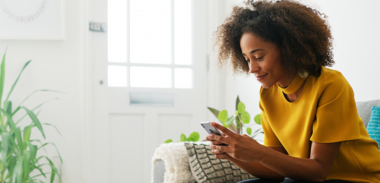 Norton LifeLock woman on mobile phone