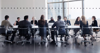 Large team meeting in a boardroom 