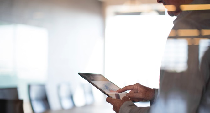 man holding tablet