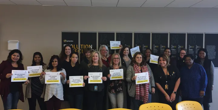 A chapter of the Women Action Network (SWAN) employee resource group together celebrating International Women's Day and how they will #PressforProgress. 