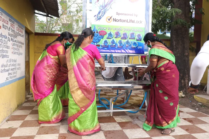 Above: Teachers at Panchayat Union Primary School have been certified in how to use the new AquaTower and try out the hand washing feature.