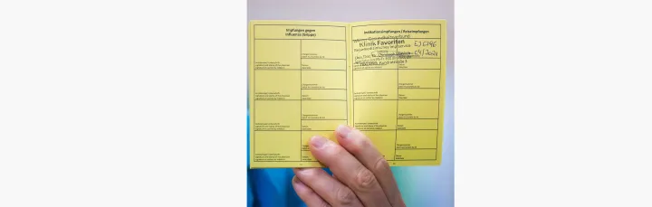 Figure 4: German proof of vaccination. Note the paper design and handwritten features. 