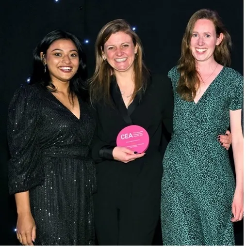 The WAGGGS team accepts the Gold CEA Award at a celebratory event in London on September 27, 2022.